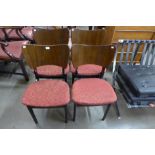 A set of four tola wood and ebonised dining chairs