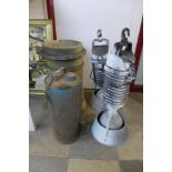 A pair of industrial lights, chimney-pot and oil can