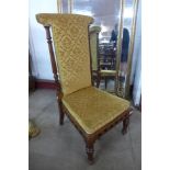 A Victorian carved walnut and fabric upholstered prie dieu