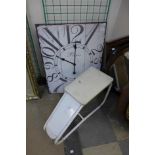 A metal Paris wall clock and a vintage foot stool