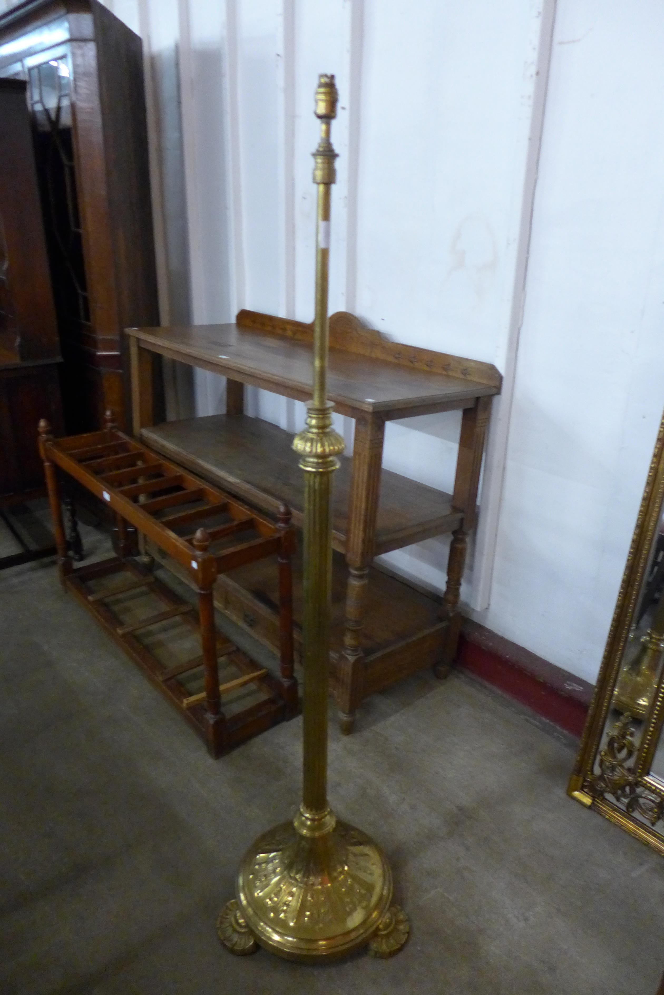 A Victorian Aesthetic Movement brass telescopic floor standing lamp