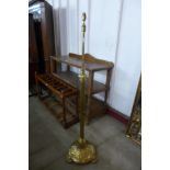 A Victorian Aesthetic Movement brass telescopic floor standing lamp