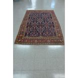 A blue ground rug, 256 x 173cms