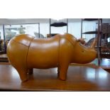 A brown leather rhinoceros stool