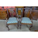 A pair of Chippendale Revival carved mahogany elbow chairs