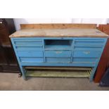 An industrial painted steel work bench