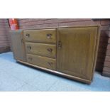 An Ercol elm Windsor sideboard