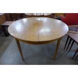 A teak extending dining table