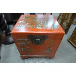 A Chinese red lacquered chest on stand