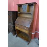 An Arts and Crafts oak bureau bookcase