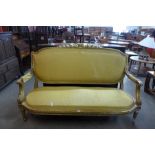 A French Louis XV style gilt wood and fabric upholstered canape sofa