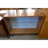 A teak display cabinet