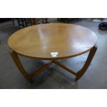 A teak circular coffee table