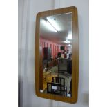 A teak framed mirror