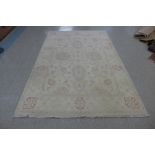 A cream ground rug, 283 x 185cms