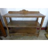 A Victorian Aesthetic Movement oak three tier buffet