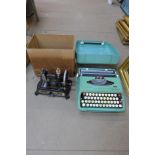 A small German Mullers sewing machine and a cased typewriter