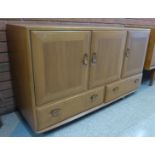 An Ercol elm Windsor sideboard