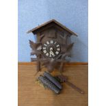 A Black Forest pine wall hanging cuckoo clock