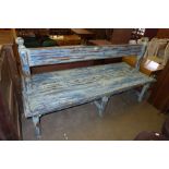 A painted wooden double sided garden bench