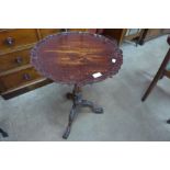 A Chippendale Revival carved mahogany birdcage action tilt top tripod table