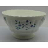 A late 18th/early 19th Century French porcelain bowl with a cornflower sprig pattern, two small
