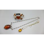 A silver and amber bangle, a silver and amber necklet and one other pendant and chain