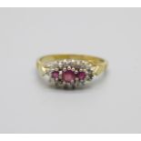 A 9ct gold ring with fifteen diamonds and three rubies, 1.7g, N