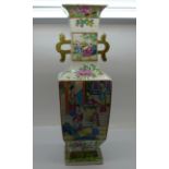 A 19th Century Chinese famille rose Canton vase, one handle and rim restored, 31cm
