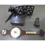 A cast metal stand, a metal figure/plaque of a Dutch girl, an Art Deco style figure of a lady, a