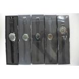 A collection of military style wristwatches, some boxed