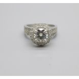 An 18ct gold and diamond ring with moissanite centre stone, 7g, M