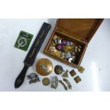 Military and other badges, a silver medallion and a copper military lidded pot, etc.
