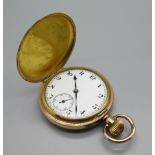 A gold plated full-hunter pocket watch with a Dennison 10 years case, lacking glass