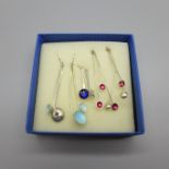 Three pairs of designer silver/enamel earrings