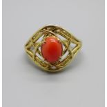 A silver gilt, coral coloured cabochon ring, P