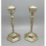 A pair of silver candlesticks, 296g with weighted bases