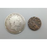 An 1819 George III silver crown and a foreign bronze coin