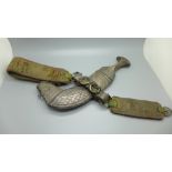 A Middle Eastern white metal mounted jambiya, scabbard a/f