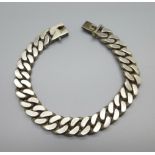A white metal curb link bracelet, 85g