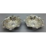 A pair of embossed and pierced silver dishes, Birmingham 1904, Walker & Hall, 75g
