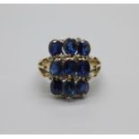 An 18ct gold, twelve diamond and nine sapphire cocktail ring, 4.9g, R