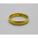 A 22ct gold wedding band, 4.9g, M