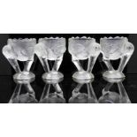 Four French glass moulded eggcups in the shape of pelicans