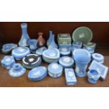 A large collection of Wedgwood Jasperware; boxes, posy vases, pin trays, etc.