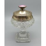 A silver topped dressing table pot with cut glass base, guilloche enamel top and mirror under the