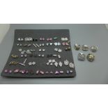 Thirty-eight pairs of silver earrings and five silver rings