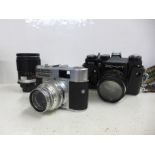 A Voigtlander camera, a Zenit camera and a Soligor 1:2.8 135mm lens