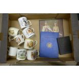 A box of Royal commemorative mugs, two books including The Coronation of Queen Elizabeth II and