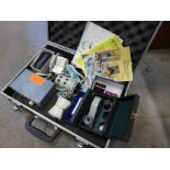 A case of gem testing equipment including a refractometer spectroscope, etc.